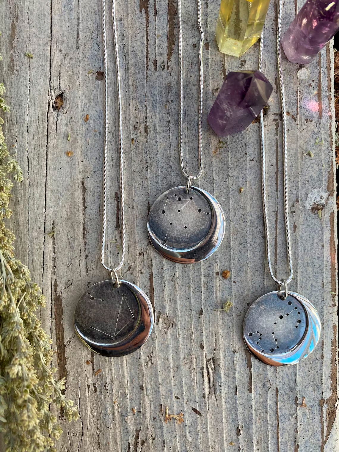 Embrace celestial beauty with our Silver Moon Zodiac Necklace. Each constellation represents a zodiac sign, custom-made just for you. Handcrafted from high-quality silver, this pendant features an oxidized night sky. The perfect birthday or holiday gift for astrology enthusiasts.