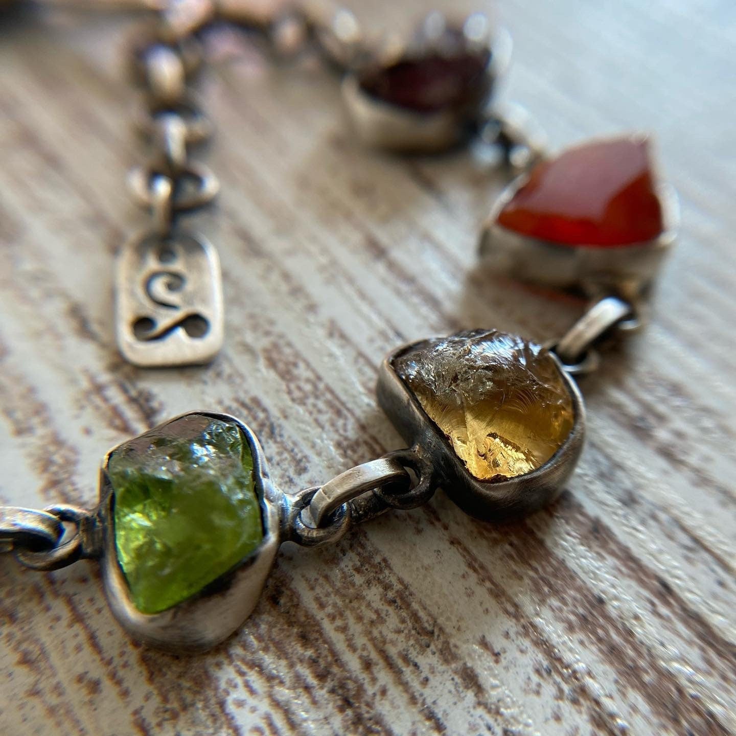 Handmade silver bracelet featuring a chakra crystal set. This unique piece includes seven natural raw stones, carefully selected to align with the seven chakras. 